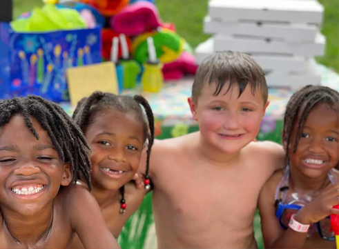 Four kids at a birthday party